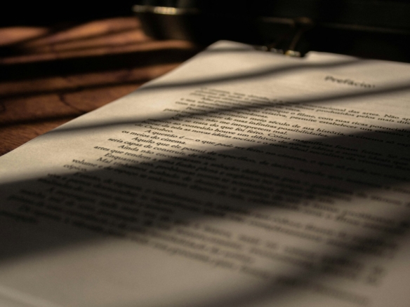 white book page on brown wooden table